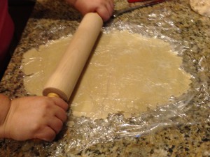 Rolling out the pie dough between layers of Saran Wrap makes this project a "breeze!"